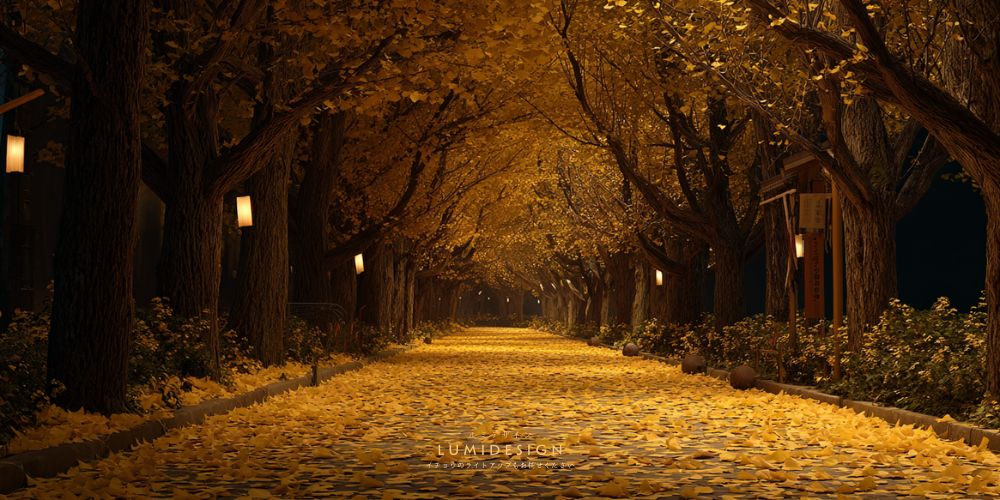 イチョウライトアップの並木道イメージ 落ち葉と照明で演出された夜景